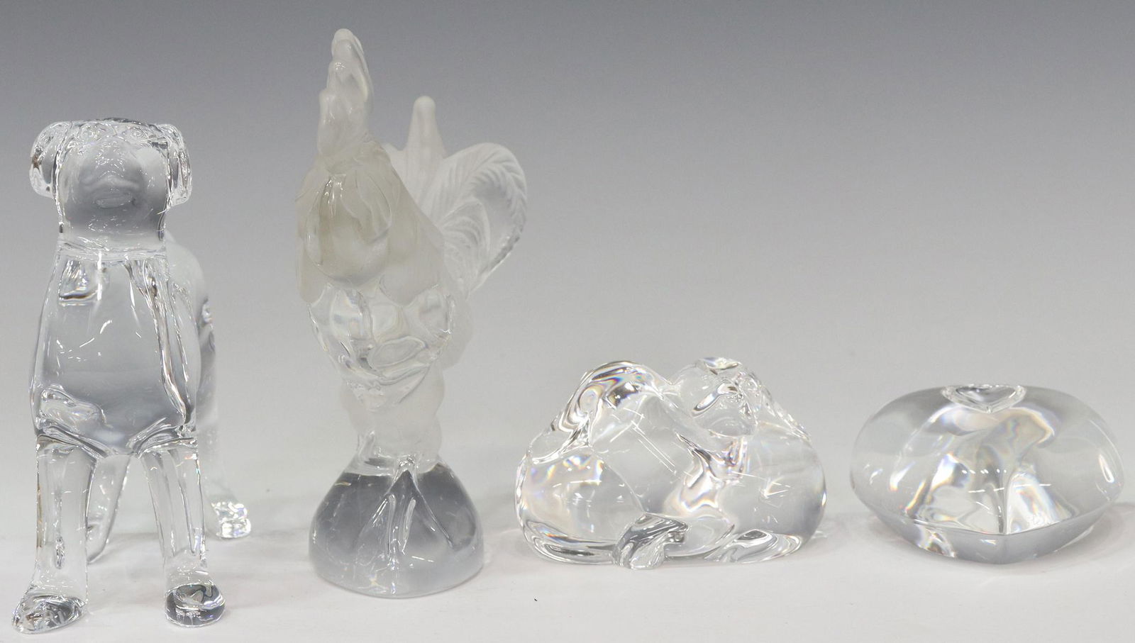 (4) DAUM, BACCARAT & STEUBEN ART CRYSTAL FIGURES: (lot of 4) Art glass and crystal figures, including: (1) Daum, Nancy "Coq" (rooster), in a satin finish, approx 5.25"h, (1) Baccarat Labrador dog, approx 4.5"h, (1) Steuben "Puppy Love" hand cooler, d