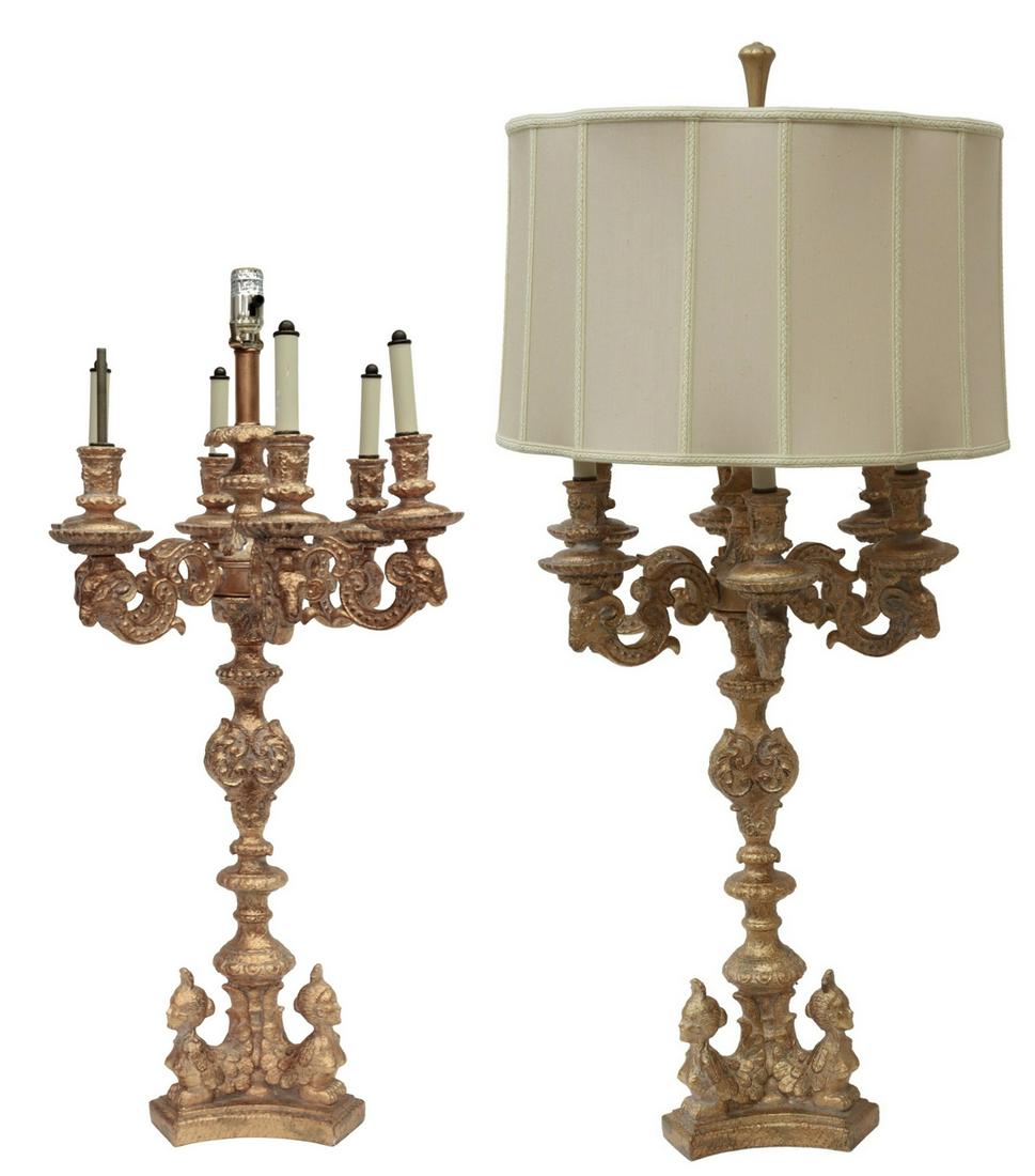(2) JOHN RICHARDS GILT CANDELABRA-FORM TABLE LAMPS: (pair) Decorative Louis XV style gilt resin/ composition candelabra-form table lamps, attributed to John Richards, 21st c., having six scrolled arms terminating in ram's head, supporting faux candles