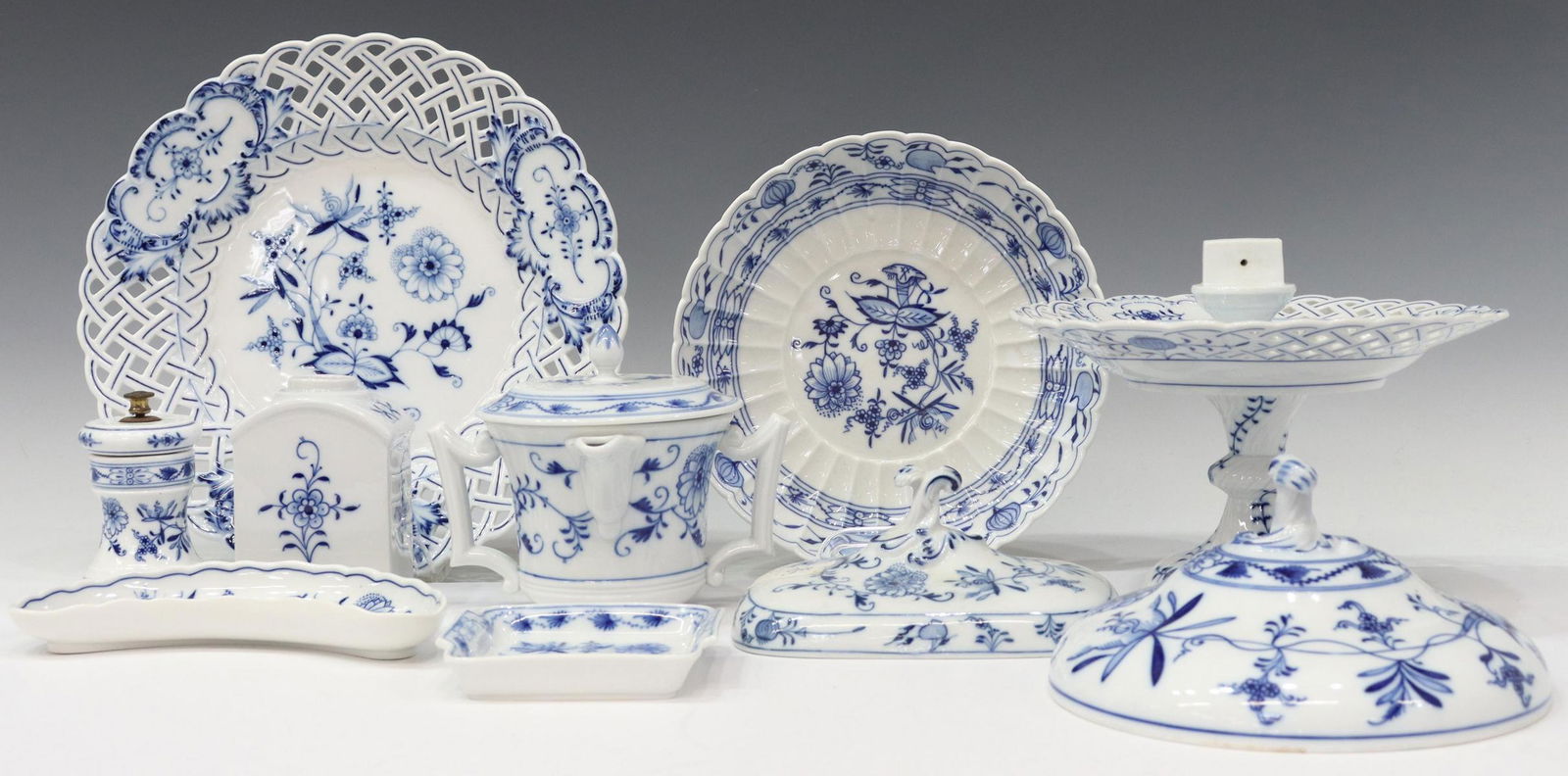 (11) MEISSEN & OTHER 'BLUE ONION' TABLEWARE: (lot of 9) Meissen and other porcelain tableware collection, in the "Blue Onion" pattern, varied marks including underglaze blue crossed sword variations and Meissen in oval, comprising: (1) footed co