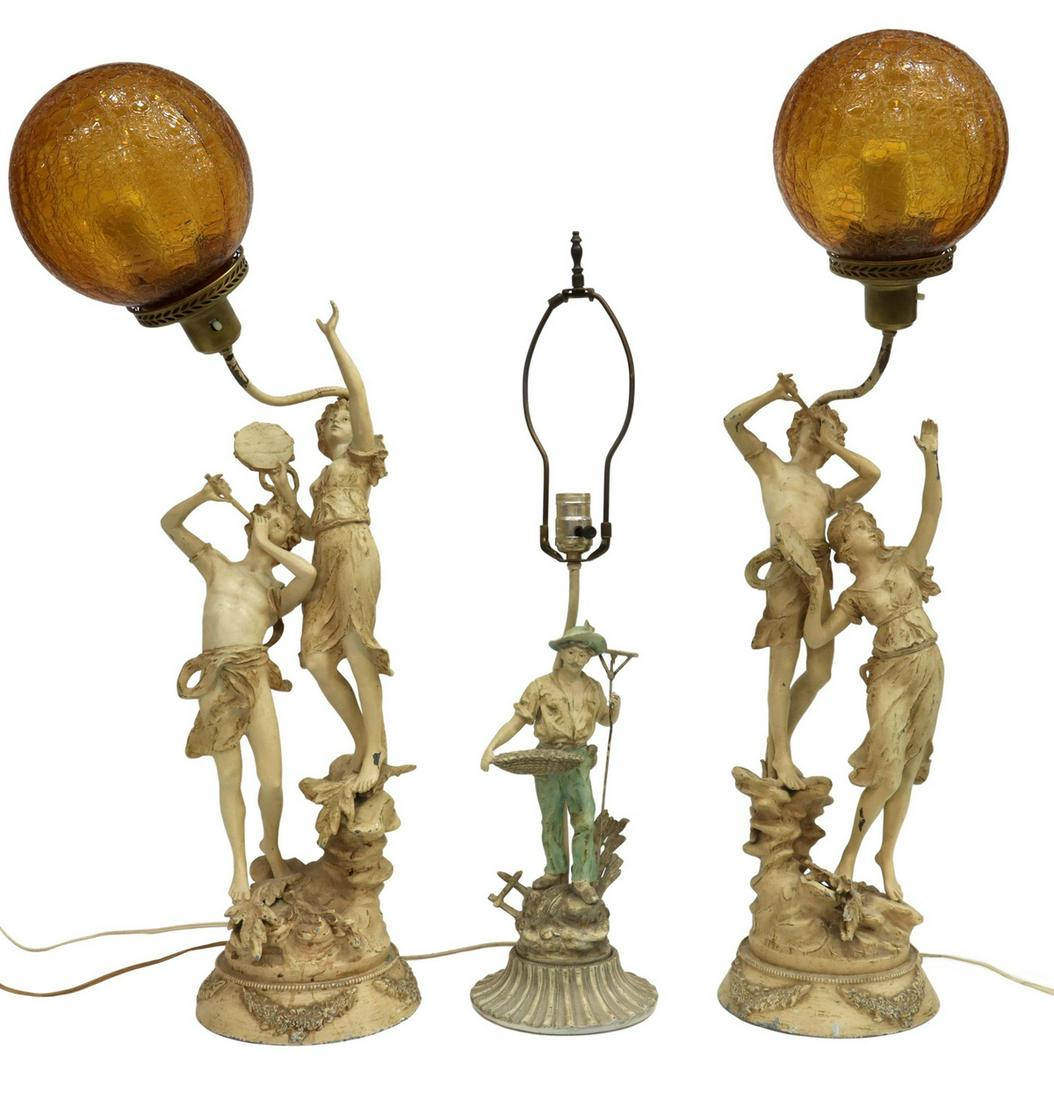 (3) FRENCH PAINTED SPELTER FIGURAL TABLE LAMPS: (lot of 3) French painted spelter figural table lamps, 20th c., after the originals by Louis Auguste Moreau (French, 1855-1919), all signed in cast L.F. Moreau, including: (two) depicting figures with