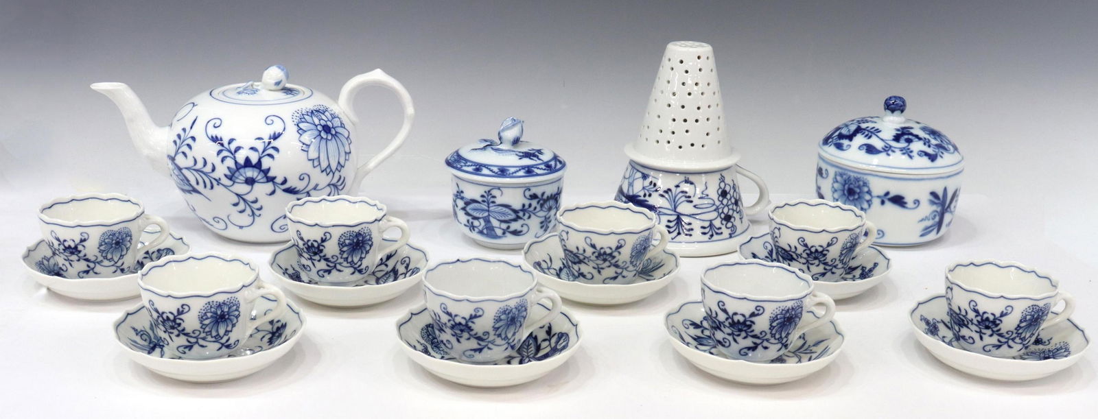 (20) MEISSEN & OTHER 'BLUE ONION' TEA SERVICE: (lot of 20) Meissen and other porcelain assembled tea service, in the "Blue Onion" pattern, varied marks, comprising: (1) teapot, bearing crossed swords mark underfoot, approx 5"h, 5.5"diam; (2) lidde