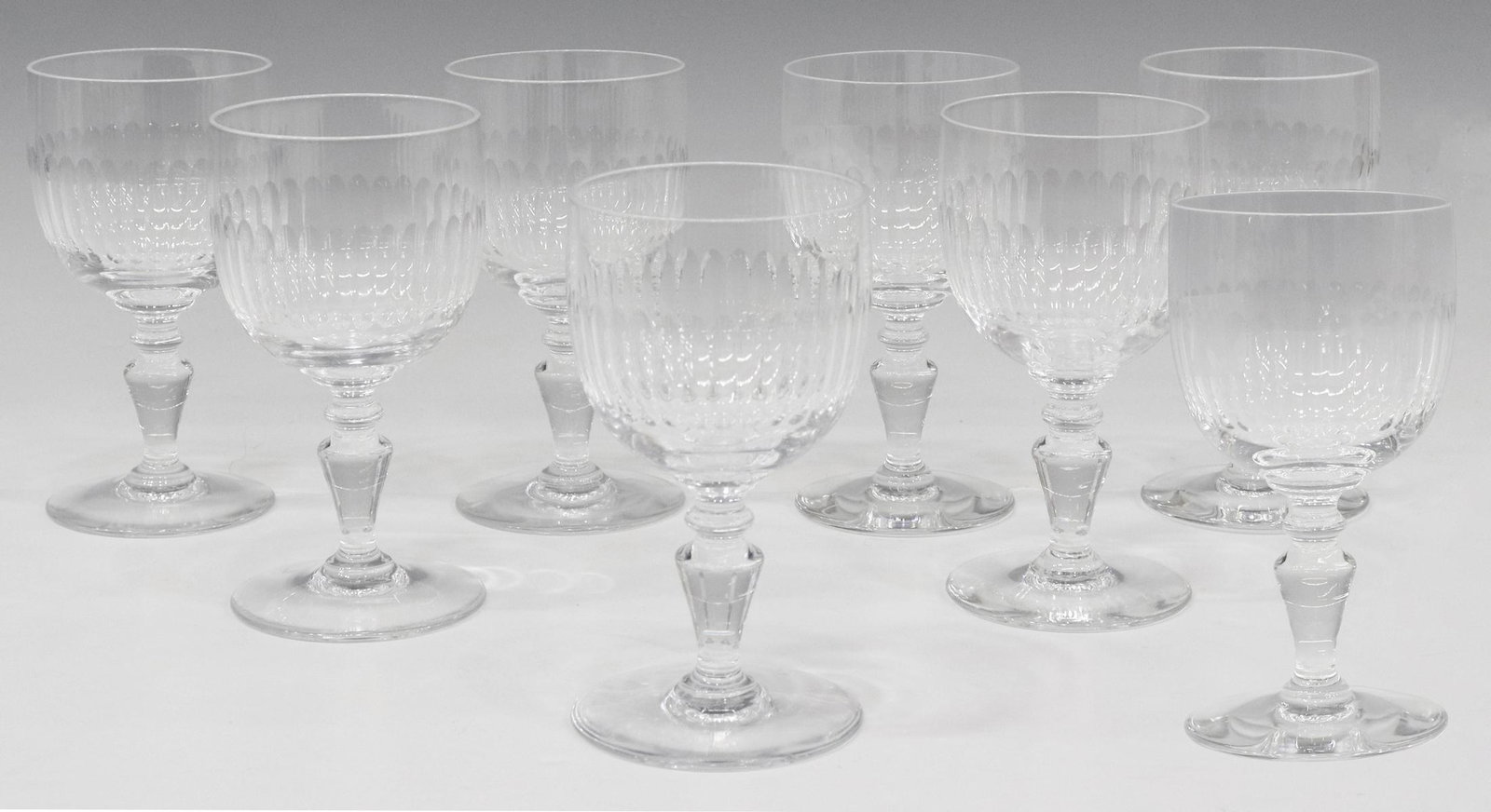 (8) BACCARAT 'RENAISSANCE' CUT CRYSTAL CLARET WINE: (lot of 8) French Baccarat "Renaissance" cut crystal claret wine stems, middle band of vertical cuts, rising on tapered baluster-form stem, on circular foot, acid-etched mark underfoot, approx 5.25"h,