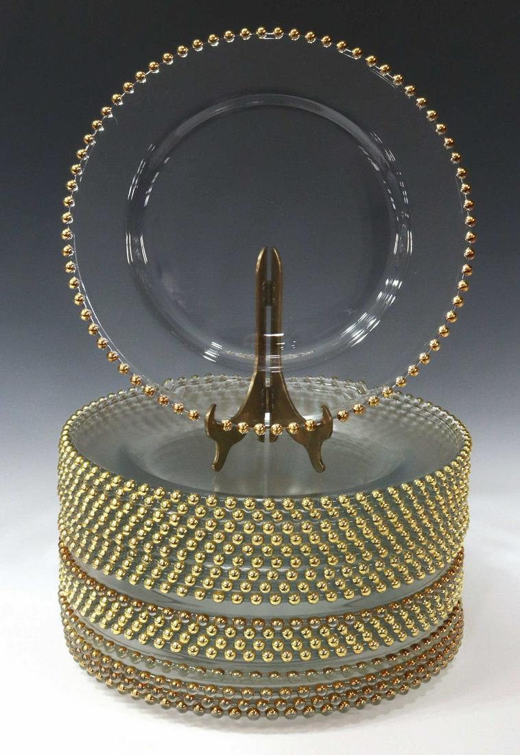 (18) LARGE COLORLESS CHARGERS WITH GILT BEADED RIM: (lot of 18) Colorless glass charger plates, rimmed with translucent gilt and copper tone beading, some surface wear, approx 13.25"diam; 45lbs total **Provenance: A fine Santa Fe, New Mexico estate col