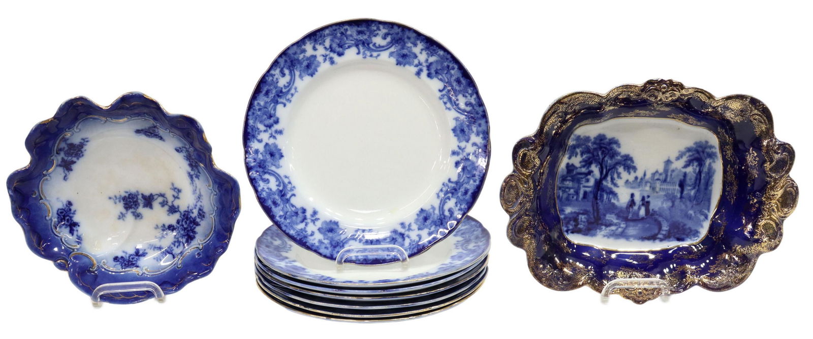 (9) FLOW BLUE SERVICE PLATES & TABLEWARE: (lot of 9) Flow blue and transferware tableware, comprising: (7) Royal Doulton flow blue plates, in the "Melrose" pattern, approx 10.25"diam, (1) La Belle China flow blue bowl, intact with star fractu