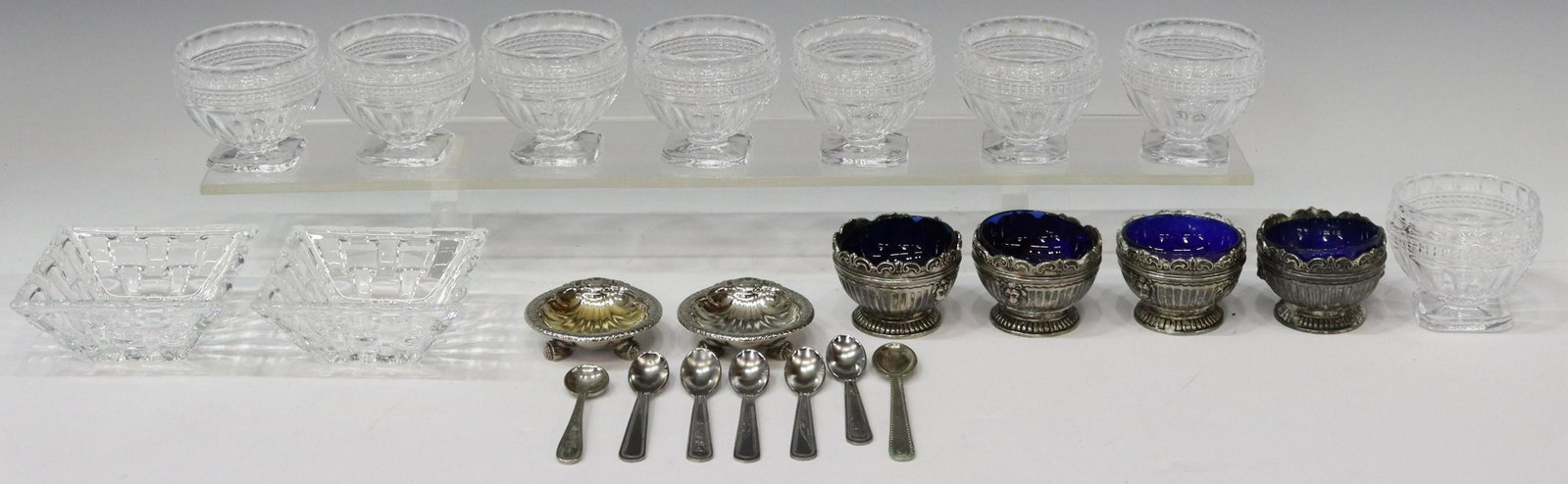 (23) VARIED INDIVIDUAL SALT CELLARS & SPOONS: (lot of 23) Salt cellars and spoons, including: (8) molded colorless glass salt cellars, on a pedestal foot, approx 2.25"h, 2 5/8"diam, (4) Godinger silver plate salt cellars, with cobalt blue glass l