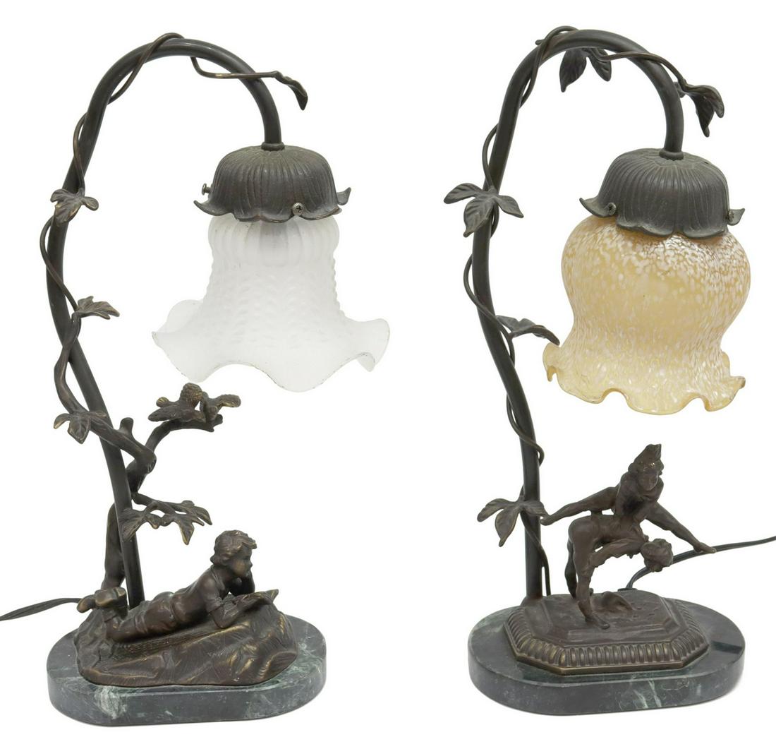 (2) DECORATIVE GLASS-SHADE GOOSENECK TABLE LAMPS: (lot of 2) Decorative gooseneck table lamps, 20th c., bronze-patina frame, varied glass shades, green marble base, (one) with boy reading a book, (one) with children playing leap frog, approx 14.5"h; 