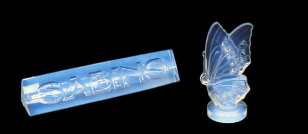 SABINO ARTICLES, BUTTERFLY & SHELF SIGN: (lot of 2) Sabino France butterfly, 2.75"h; Sabino rectangular shelf sign, chip to back corner, 1"h, 4.75"w, 1"w, total .5lbs