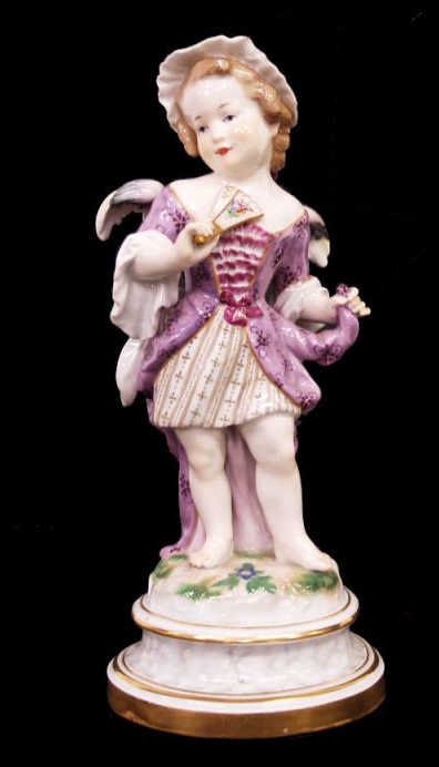 MEISSEN PORCELAIN FIGURE CUPID IN DISGUISE: Meissen porcelain figure, early 20th c, modeled as cupid dressed as a girl holding a fan, raised on a marbelized base with gilt borders, blue crossed swords mark underglaze bracketed by bi-century mar