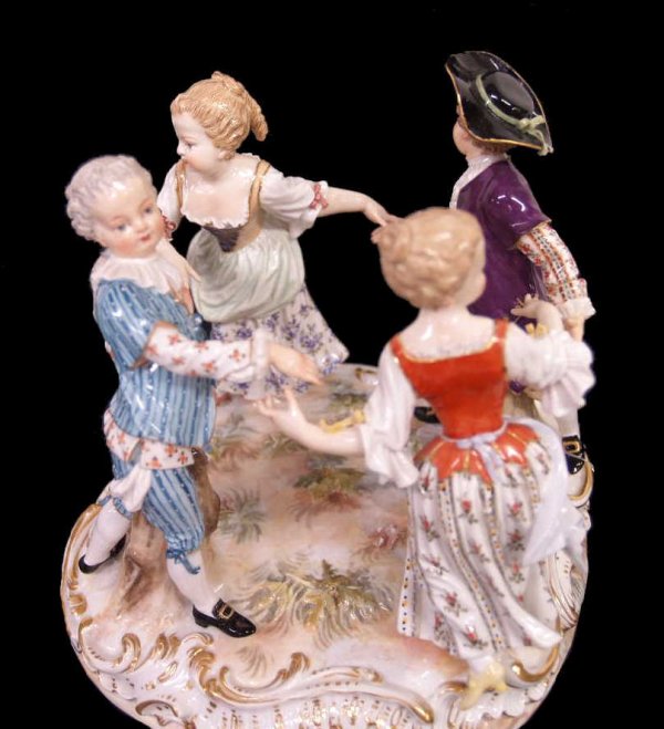 MEISSEN PORCELAIN FIGURAL GROUP, CHILDREN DANCING: Meissen porcelain figural group, late 19th c., modeled as four children dancing in a ring, blue crossed swords mark underglaze, stamped 86, incised 2728, 6"h, 6.75"diam., 2.75lbs**Condition~ two finge