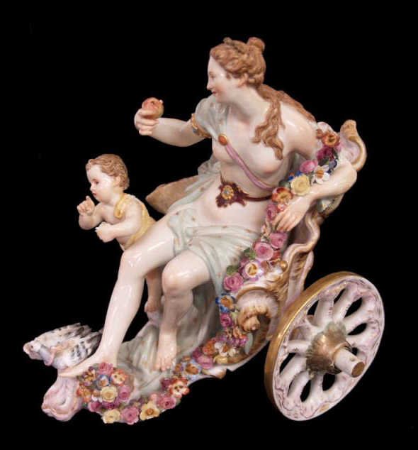 MEISSEN PORCELAIN ALLEGORICAL FIGURAL GROUP, VENUS: Meissen porcelain allegorical figural group, late 19th c., a depiction of Venus seated in a shell form chariot with gilt accents, a winged cherub at her side while a pair courting of doves sit at her