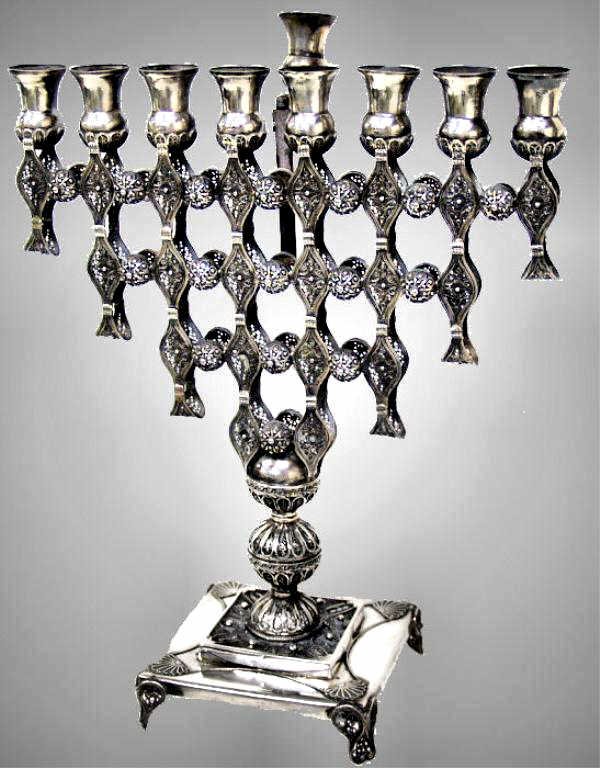 FINE YEMENI SILVER FILIGREE MENORAH, MAKERS MARK: Yemeni silver menorah, 20th c., intricate filigree work throughout, square base rising on conforming feet, marked indistinctly ?925 (possibly 823?) and makers mark, 12.75"h, 10"w, approx. 670 grams