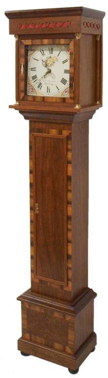 ENGLISH VICTORIAN GRANDFATHER LONGCASE CLOCK: English rosewood longcase clock, c. 1850, signed at face "James Reynolds, Wadebridge (Southwest, England), Roman numerals, floral paintings at each corner, mahogany case with contrasting color banding