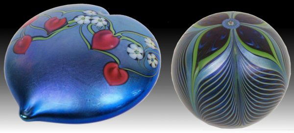 ORIENT & FLUME ART GLASS LIMITED PAPER WEIGHTS: (lot of 2) Orient & Flume art glass paperweights; (1)heart shaped with vine and red flowers on a blue ground, edition 28/250, artist C. Hosler, 2"h, 4"w, 4.25"d; (1) round in a pulled feather pattern