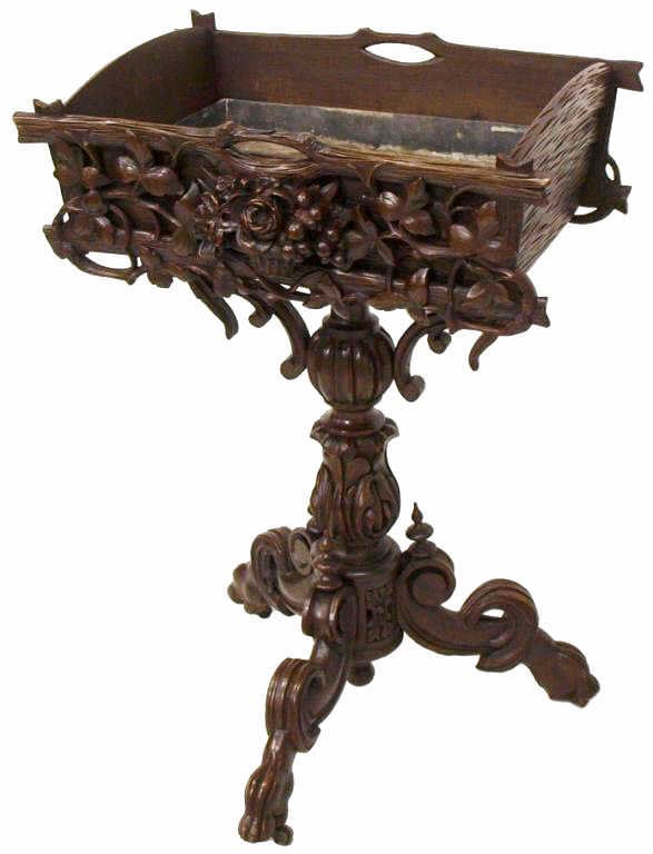 ANTIQUE SWISS BLACK FOREST CARVED TWIG PLANTER: Exceptional Swiss 'Black Forest' twig planter, late 19th c., the rectangular box with metal liner carved with twigs and vining foliates, centering an overflowing floral and fruit basket, on an elabora