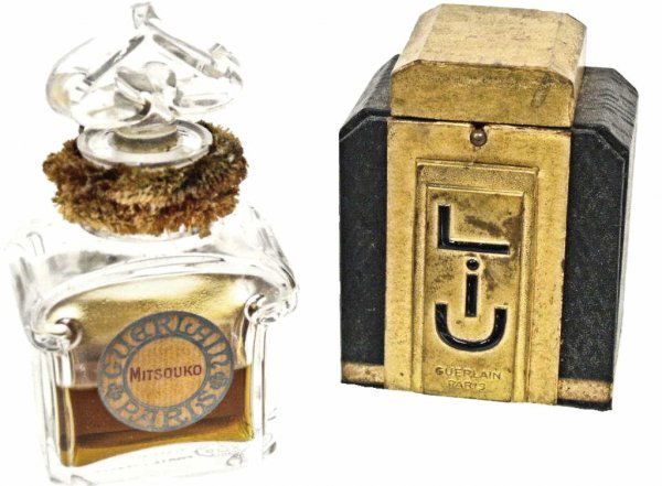 BACCARAT CRYSTAL SCENT BOTTLES FOR GUERLAIN, PARIS: (lot of 2) Baccarat crystal scent bottles for Guerlain perfume, Paris France: (1) retaining original paper label, "Mitsouko", 5"h; (1) "Liu" in the original Guerlain leather box, the black Baccarat bo