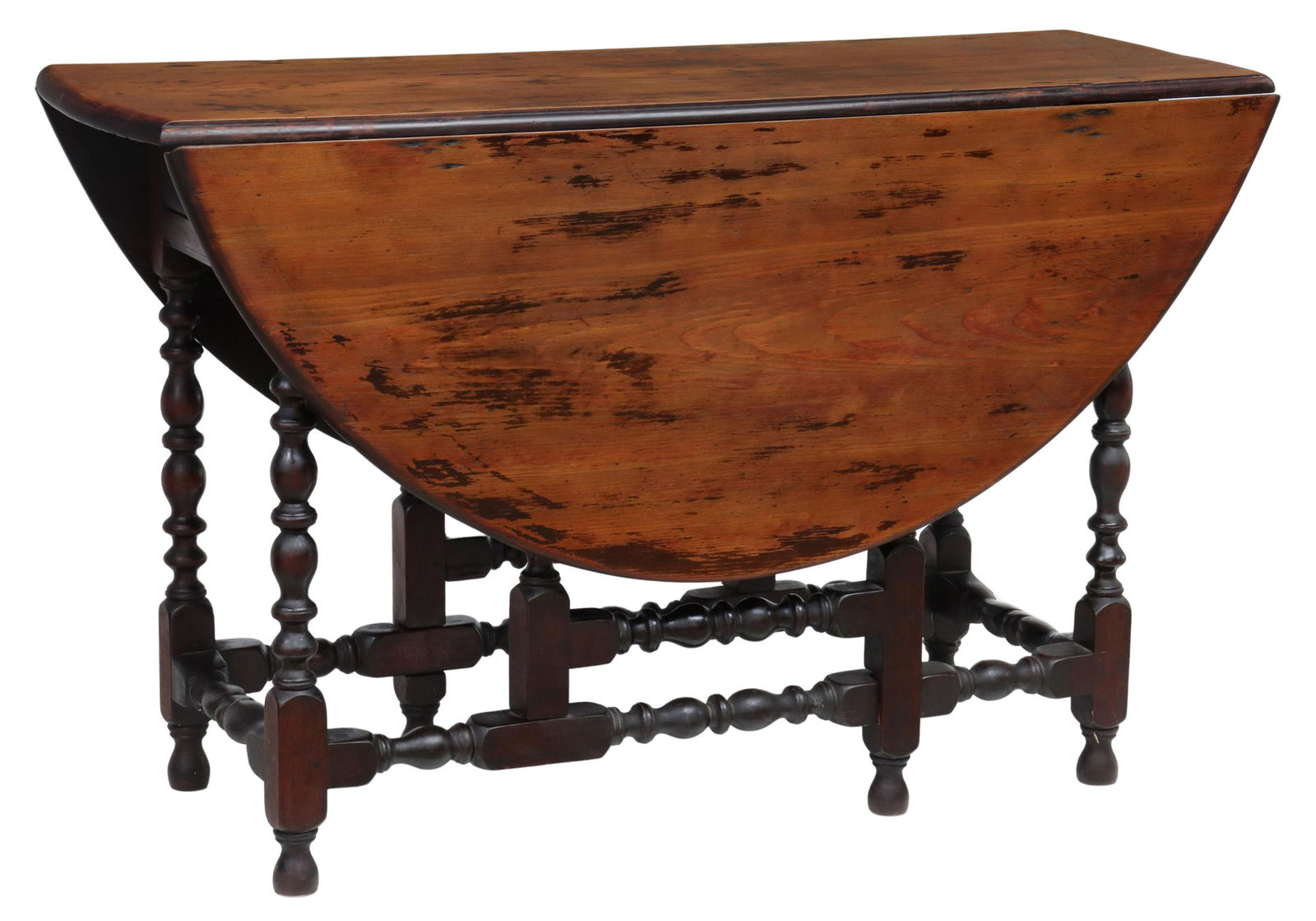 NEW HAMPSHIRE WILLIAM & MARY STYLE GATE LEG TABLE: American William and Mary style gate leg table, New Hampshire, 18th c., having scrubbed round pine top with two drop leaves, over maple wood base in a varnished finish over red paint, fitted with sing