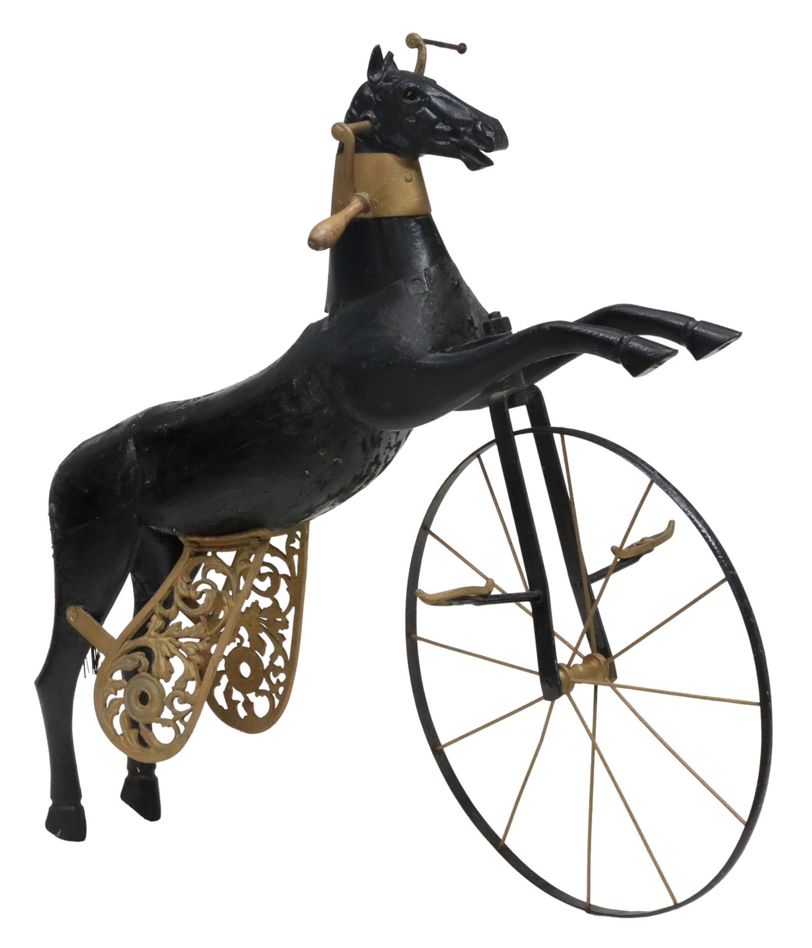 FRENCH HORSE VELOCIPEDE TOY TRICYCLE, LATE 19TH C.: French horse velocipede/ toy tricycle, late 19th c., cast iron head, painted wood body in leaping posture, fitted with parcel gilt front metal wheel, hand-crank, fixed foot pedals, collar and rear sup
