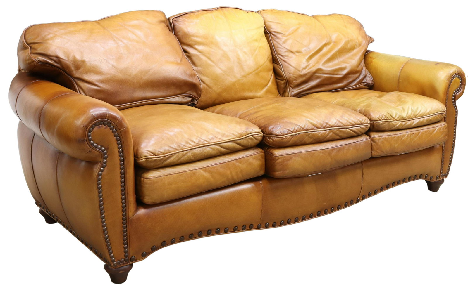 CONTEMPORARY KING HICKORY LEATHER THREE-SEAT SOFA: Contemporary brown leather sofa, King Hickory, late 20th c., having scalloped back and apron, rolled arms, upholstery fixed with large nail head trim, removable upper and lower cushions, rising on tur