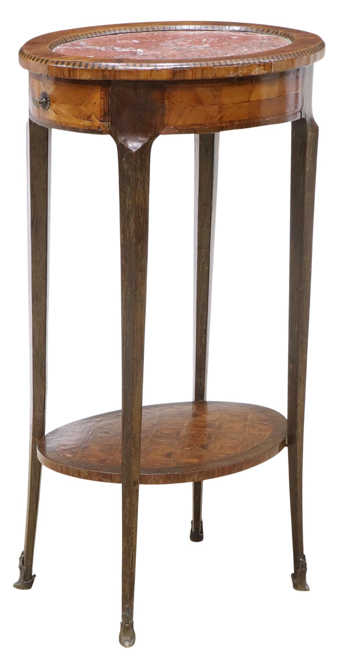 FRENCH LOUIS XV STYLE MARBLE-TOP SIDE TABLE: French Louis XV style marble-top parquetry side table, early 20th c., oval shape, with inset rouge marble top, matched veneer with parquetry, fitted with single drawer, over medial shelf, rising on ca