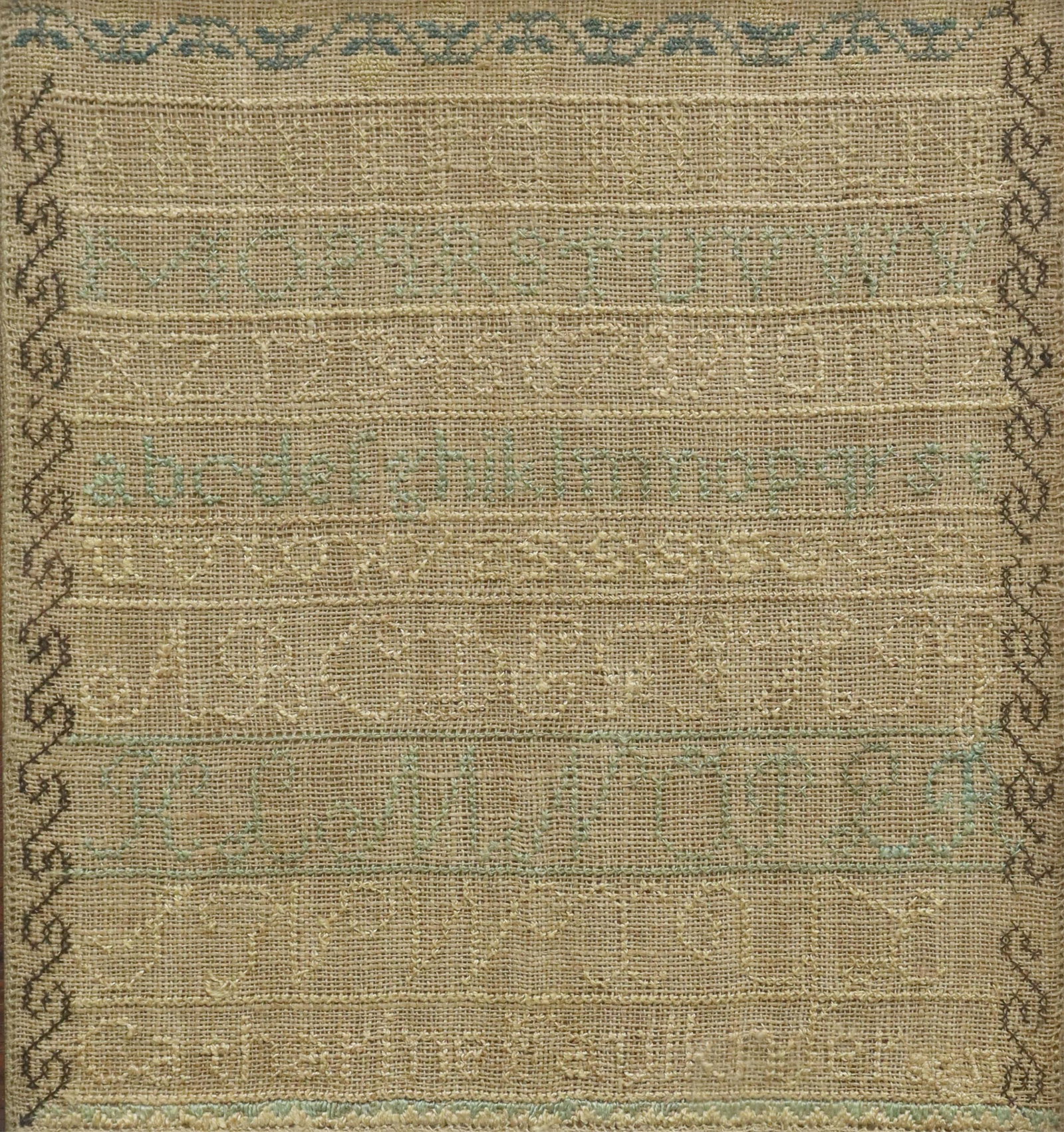 CATHERINE FAULKNER NEEDLEPOINT SAMPLER: Framed needlepoint sampler on linen, 19th c., Catherine Faulkner, with uppercase, lowercase, and cursive alphabets, numerals, ornamental borders, reverse with label for E.A. Walton Fine Arts, Springfi