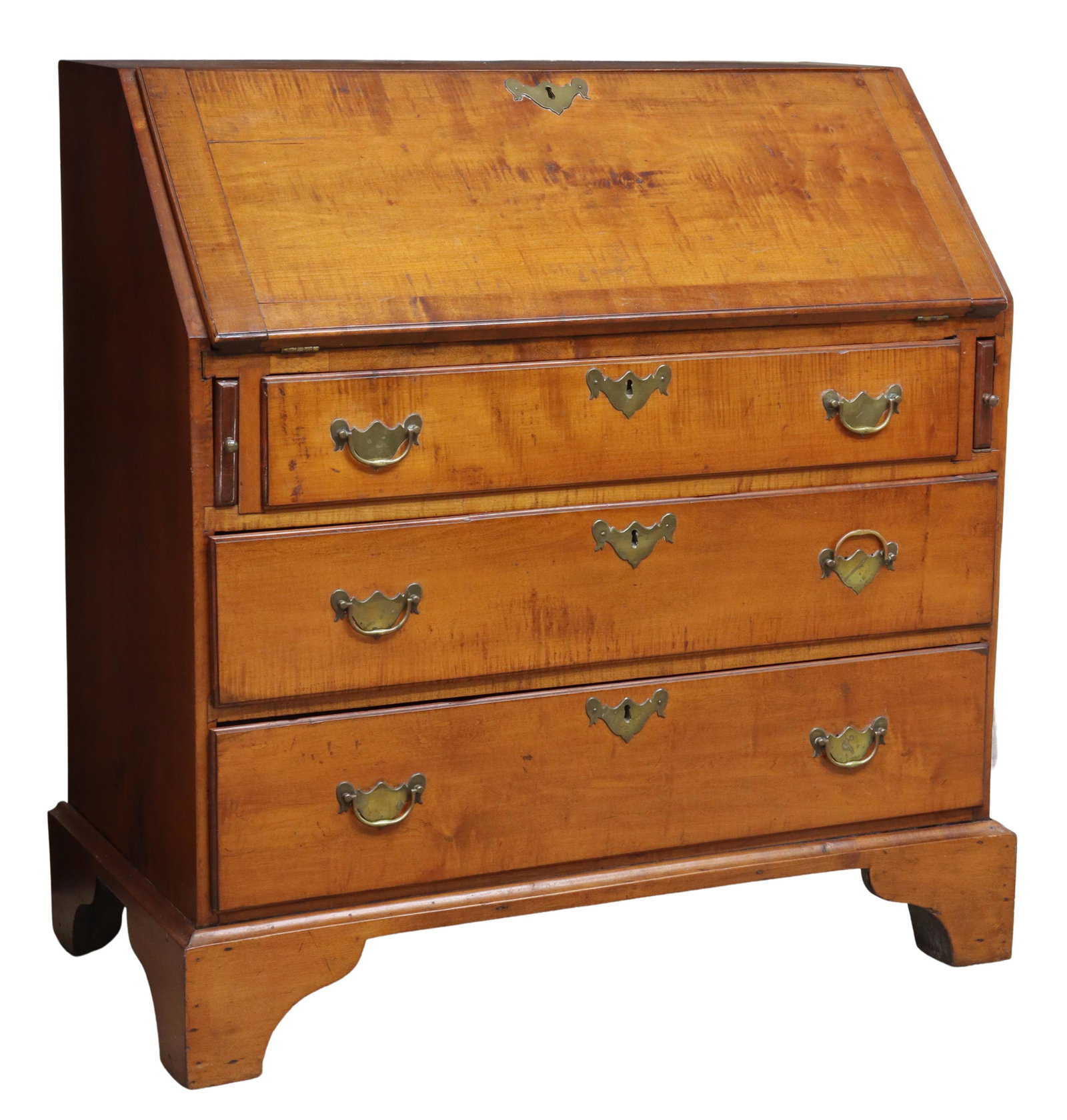 AMERICAN CHIPPENDALE TIGER MAPLE SLANT-FRONT DESK: American Chippendale tiger maple slant-front desk, New England, 18th/ 19th c., having gallery top with hand-joined dovetails, slant front opening to interior fitted with drawers, open niches, and hidd