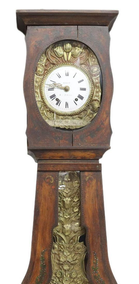FRENCH MORBIER PAINTED PINE LONG CASE CLOCK: French morbier painted pine long case clock, 19th c., molded cornice over painted pine case, with floral accents, single door with pendulum viewing panel, lower section depicting painted village scene