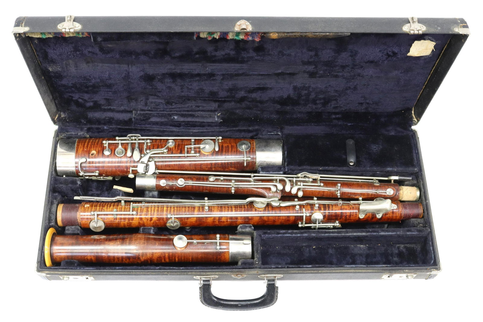 G.M. BUNDY BASSOON WOODWIND INSTRUMENT IN CASE: G.M. Bundy bassoon, made in Elkhart, Indiana, 5239, presented in fabric lined padded Conn brand case, lacking mouth piece, loss to leather trim, case: approx 4"h, 27.25"w, 11.25"d, 13lbs **Provenance: