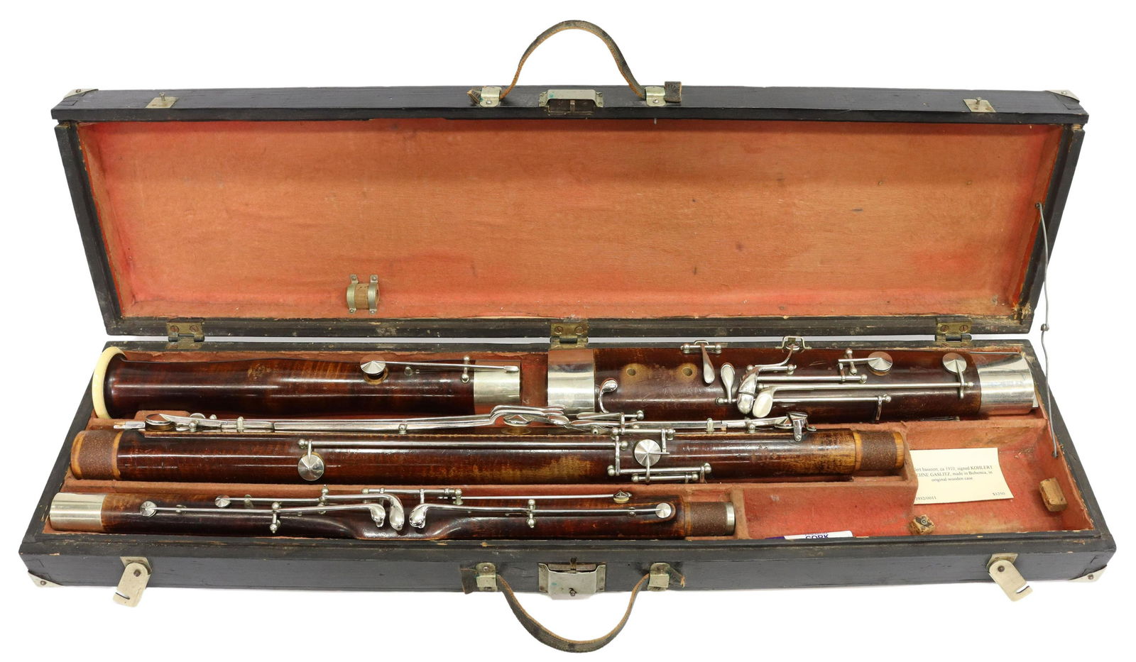 V. KOHLERT SOHNE BASSOON, CZECHOSLOVAKIA, 20TH C: V. Kohlert Sohne bassoon, Graslitz, Czechoslovakia, No. 1319, early 20th c., presented in original fabric lined wood case, lacking mouth piece, loss to leather carrying handles, approx 3.5"h, 32.5"w,