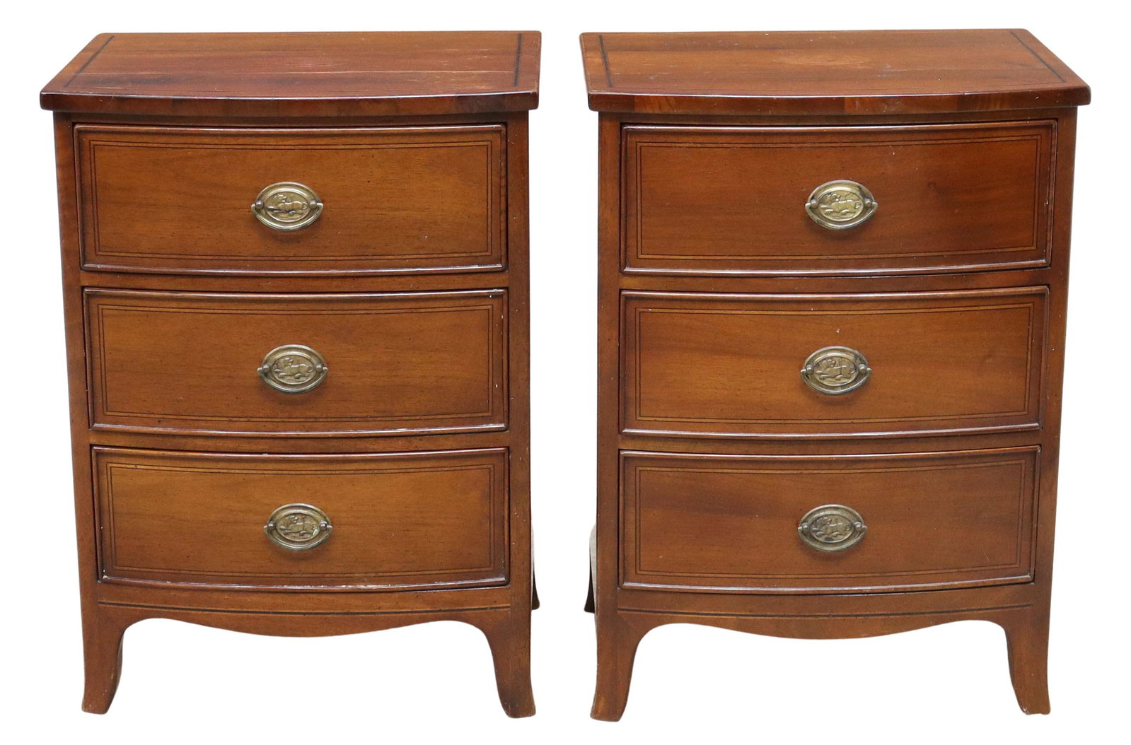 (2) GEORGIAN STYLE MAHOGANY BEDSIDE TABLES: (pair) Georgian style mahogany nightstands, Pregno, late 20th c., top with contrasting shell cartouche, bowfront case fitted with three drawers, contrasting string inlay, rising on French bracket feet