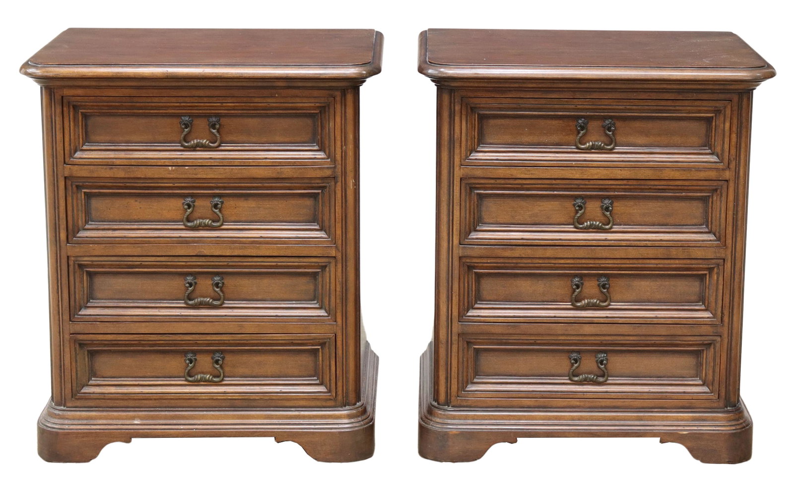 (2) ITALIAN WALNUT BEDSIDE CABINETS: (pair) Italian walnut bedside cabinets, late 20th c., having rounded rectangular top over four molded drawers, flanked by carved corner posts, rising on bracket feet, approx 25.75"h, 22.25"w, 15.25"d 