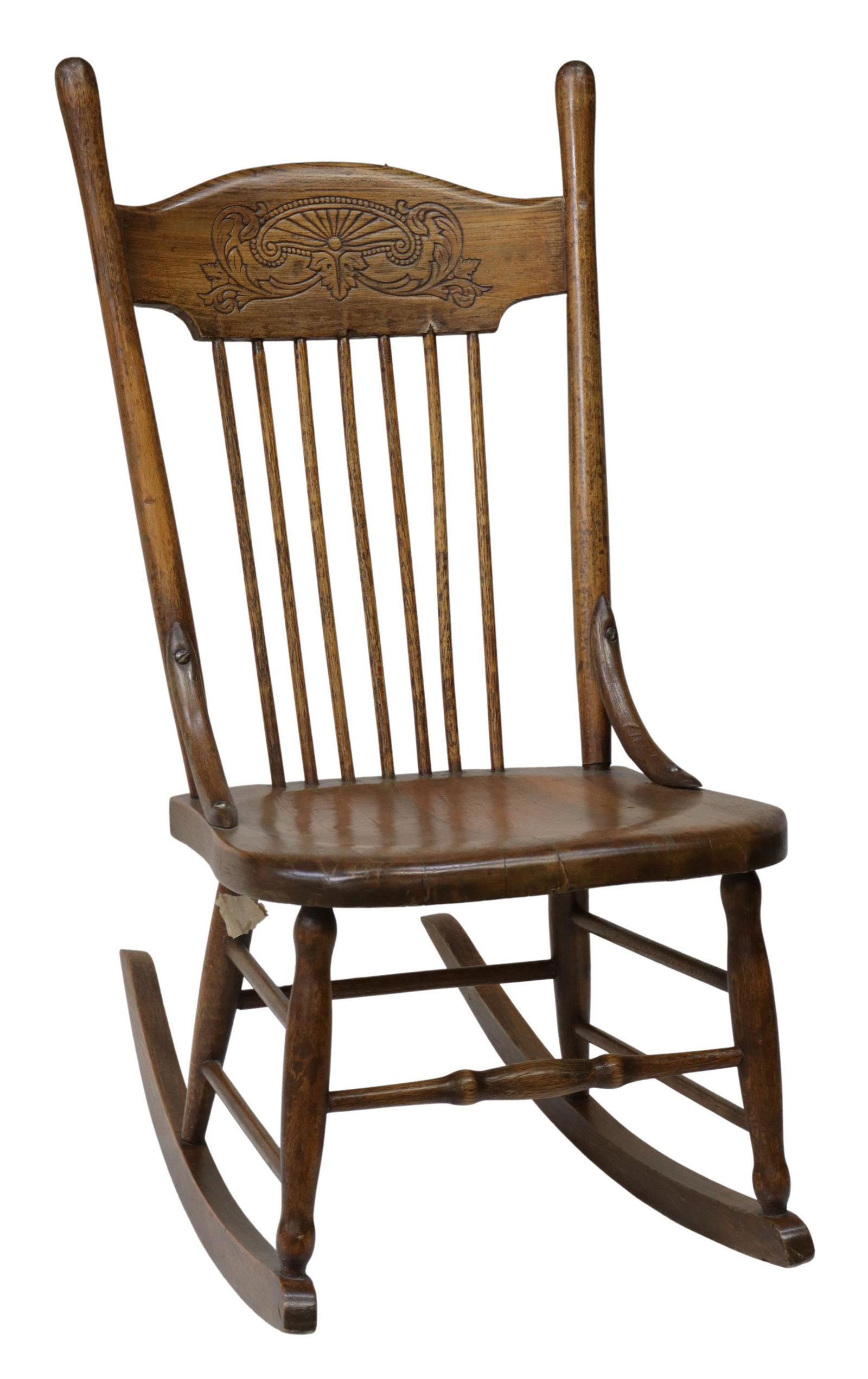 AMERICAN OAK PRESSBACK ROCKING CHAIR: American oak pressback rocking chair, c.1900, curved top rail, rounded stiles, turned spindle back splat, rising on stretcher-joined rocker rails, approx 35"h, 16.75"w, 28"d, seat height: 15"h Start P