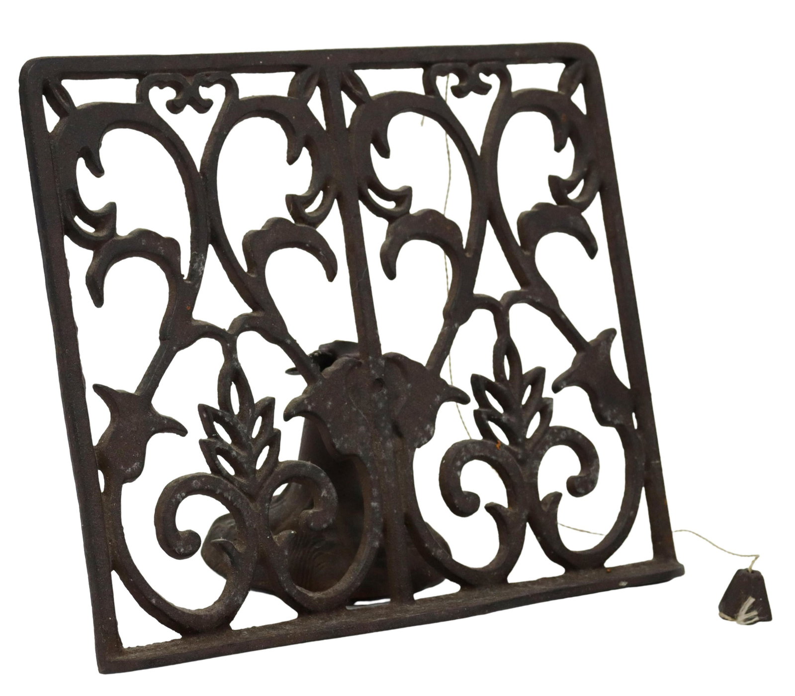 CAST IRON ORNAMENTAL BOOK REST STAND: Cast iron book rest/ stand, adjustable angle, openwork back with scrolled foliates, on a circular foot, approx 8"h, 10.5"w, 3.75lbs Start Price: $100.00