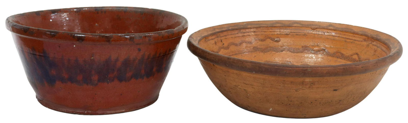 (2) AMERICAN SLIP-DECORATED REDWARE BOWLS, 19TH C.: (lot of 2) American slip-decorated redware bowls, 19th c., comprising: (1) New England, red glazed with manganese band, intact with hairline fracture, approx 4.75"h, 10.25"diam; (1) having red linear