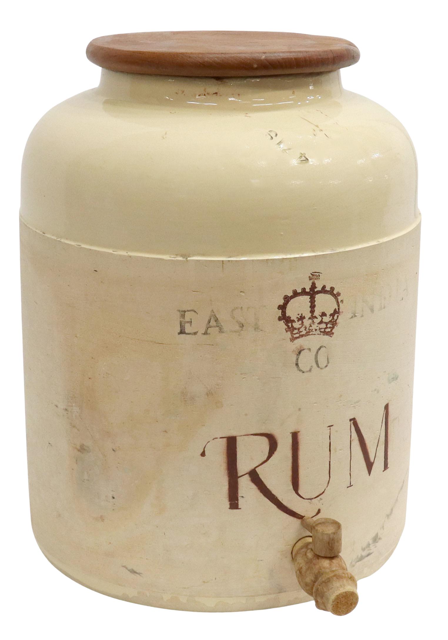 BRITISH COLONIAL EAST INDIA CO STONEWARE RUM CROCK: British Colonial stoneware rum cask/ crock, early 20th c., attributed to Corona Stoneware, wooden lid, front stenciled East India Co. with crown, accompanied by wood spigot, chips, approx 14.75"h, 11"