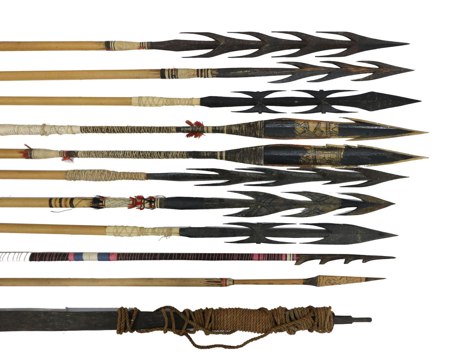 (11) PERU AMAZON TRIBAL BOWS & ARROWS: (lot of 11) Peruvian Amazon tribal bow and arrows: (10) arrows up to 74"l, extremely sharp wood arrowheads; (2) wood bows Start Price: $80.00