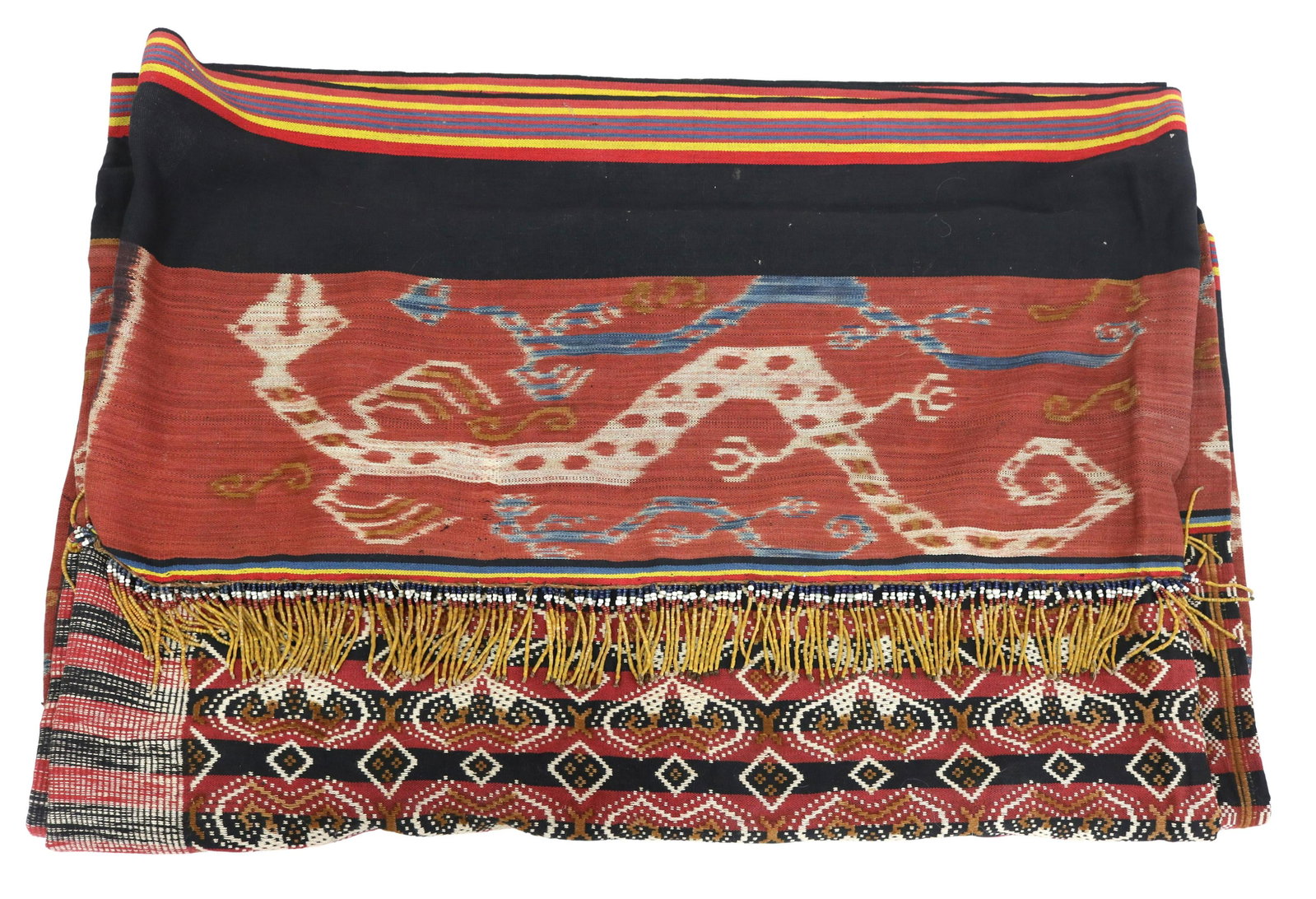 SUMBA, INDONESIA IKAT DYED FABRIC CEREMONIAL CLOTH: Ceremonial cloth, said to be a burial cloth, Ikat dyed fabric, Sumba, Indonesia, embellished with beads, geometric patterns and lizards, sewn as a bag with both ends open, approx 72" x 27" Start Price