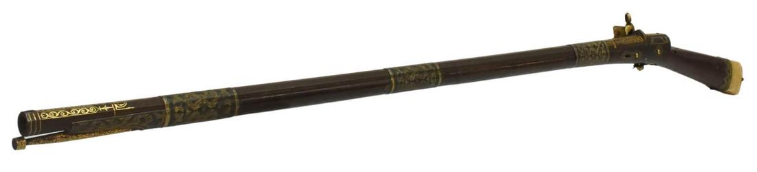 CIRCASSIAN HIGHLY GOLD INLAID FLINTLOCK RIFLE: Circassian flintlock rifle with figured hardwood stock, 18th c., 39" octagonal rifled Damascus barrel, three wide metal barrel bands with foliate decoration, elaborate damascened gold inlay at barrel 