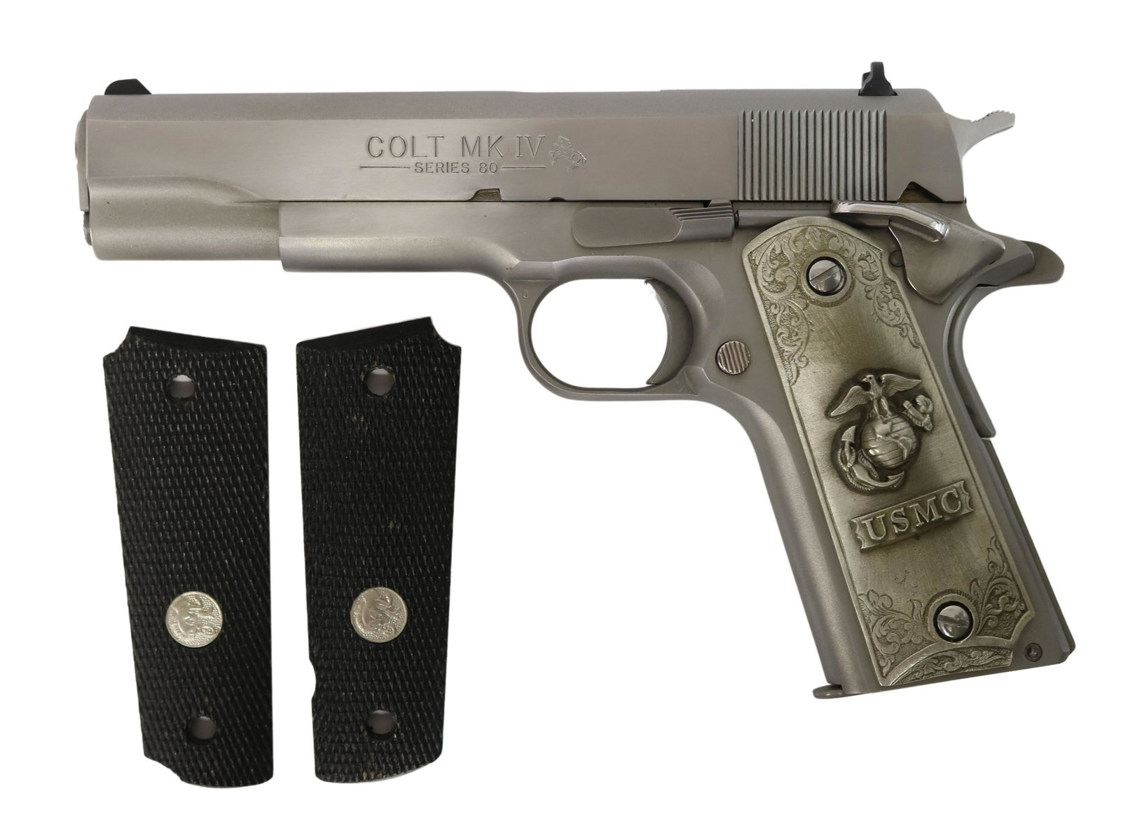 COLT GOVERNMENT MARK IV, SERIES 80 .45 PISTOL: Colt Government Model Mark IV,Series 80, .45 caliber, 5" barrel, stainless steel, later U.S.M.C. grips with raised emblem by Pilgrim Pewter Co., appears in 99% condition, housed in original packing wi