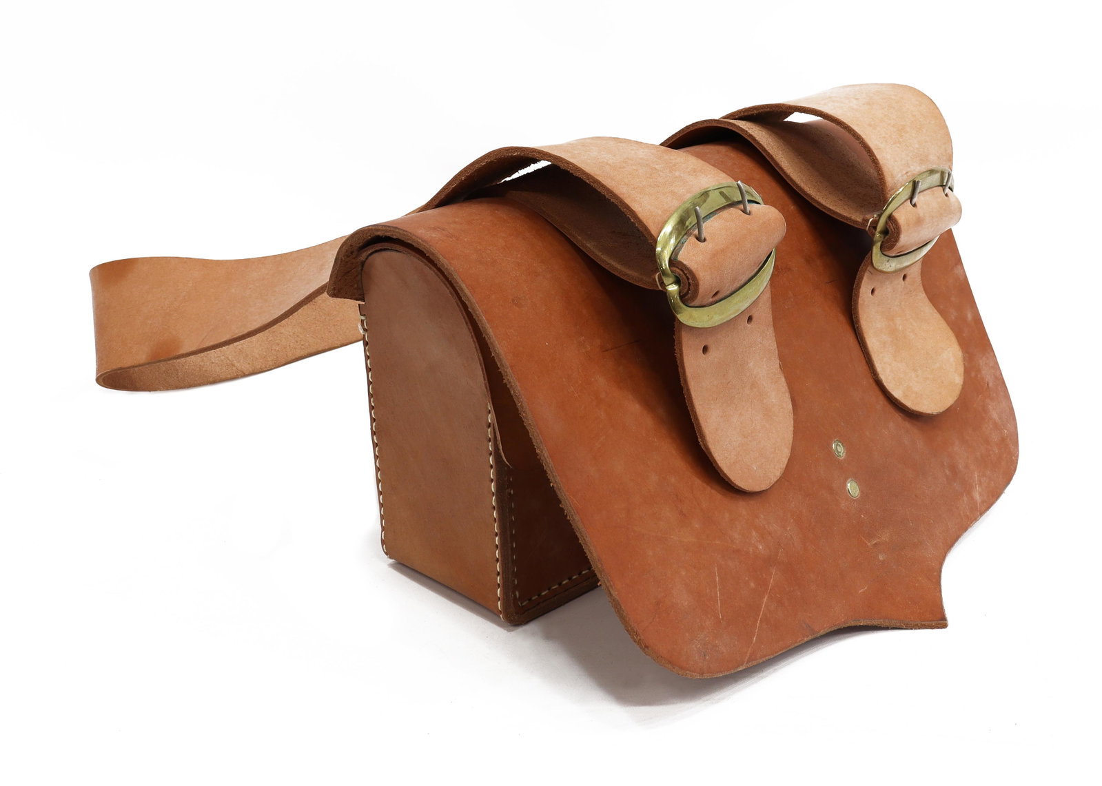 LEATHER BLACKPOWDER 30 RND CARTRIDGE CASE: Heavy brown leather flap case with interior blackpowder 30 round wood cartridge holder above a lower tin box storage, attached wide sling, case: approx. 8.5"h, 13.25"w, 4"d, total: 4.25lbs *Provenance
