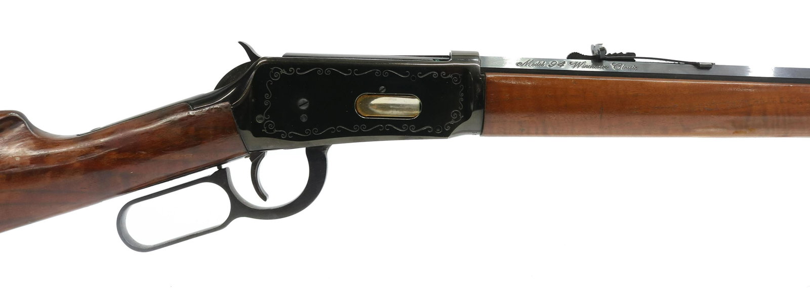 WINCHESTER M94 CLASSIC 30-30 CALIBER, LEVER ACTION: Winchester Model 94 Classic, .30-30 caliber. lever action, 25.25" octagonal barrel, tubular magazine, fixed front sight, adjustable rear sight, light engraving at the receivers with saddle ring at rig