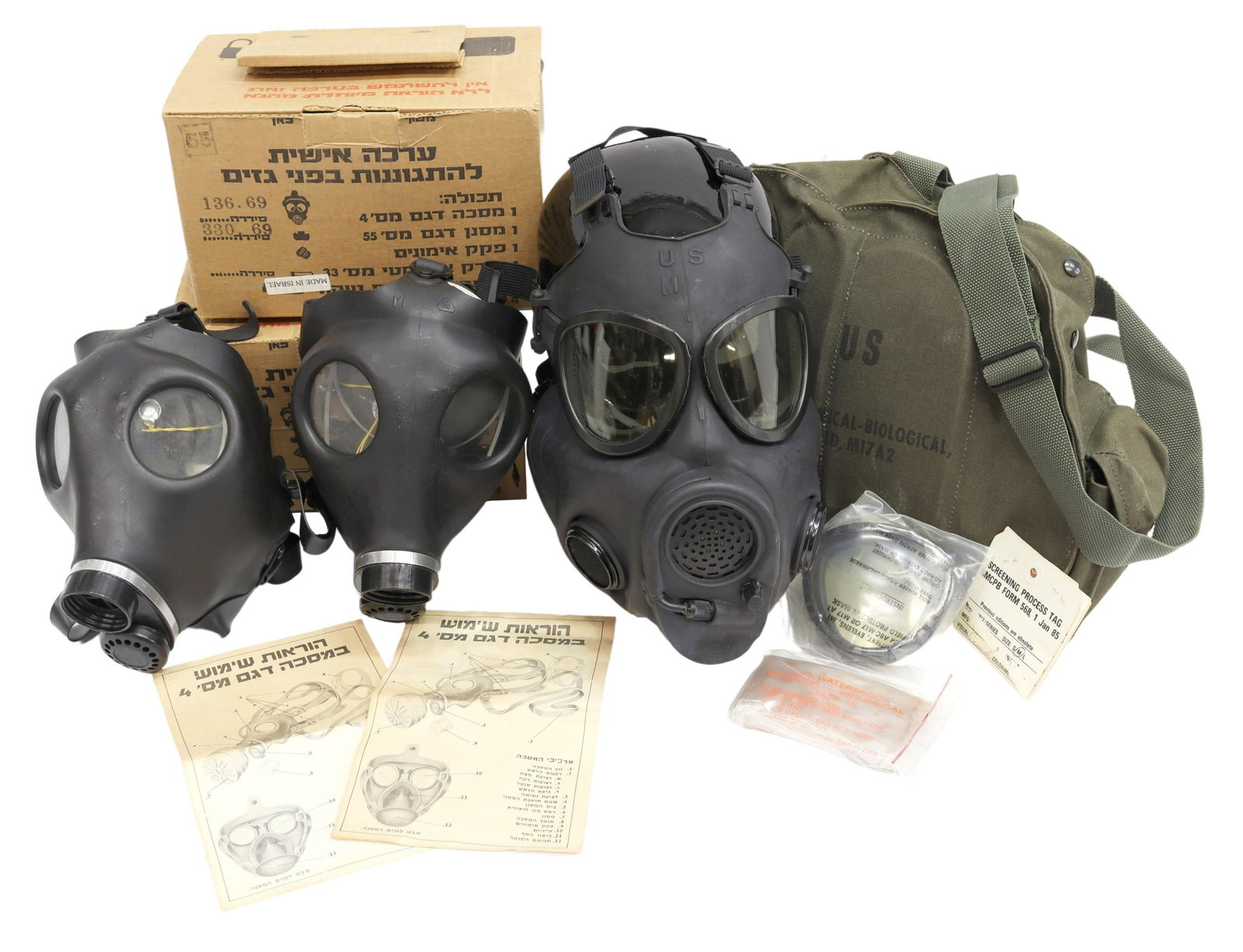 (3) GAS MASKS, U.S. & ISRAEL: (lot of 3) Gas masks: (1) U.S. M17A2 mask with cloth carry bag and strap; (2) Israeli gas mask, unopened in cardboard boxes, largest approx. 9.25"h, 10.5"w, 6.25"d, total: 7lbs *Provenance: Estate of 