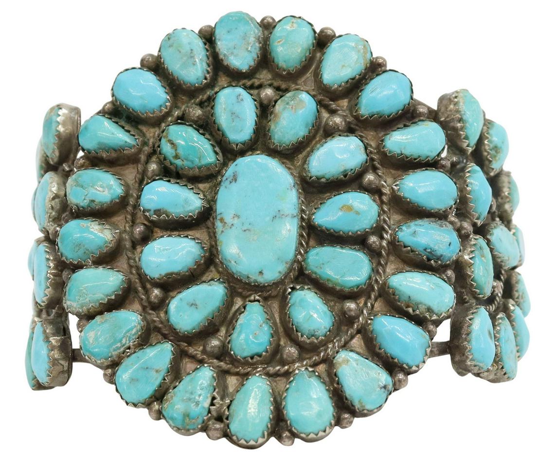 NATIVE AMERICAN SILVER & TURQUOISE CLUSTER CUFF: Native American silver (content unknown) cuff bracelet, with radiating clusters of turquoise, on a split shank cuff, central plaque: approx 2.5"h, 2 1/8"w, interior: approx 5 5/8", gap: approx 1.25", 