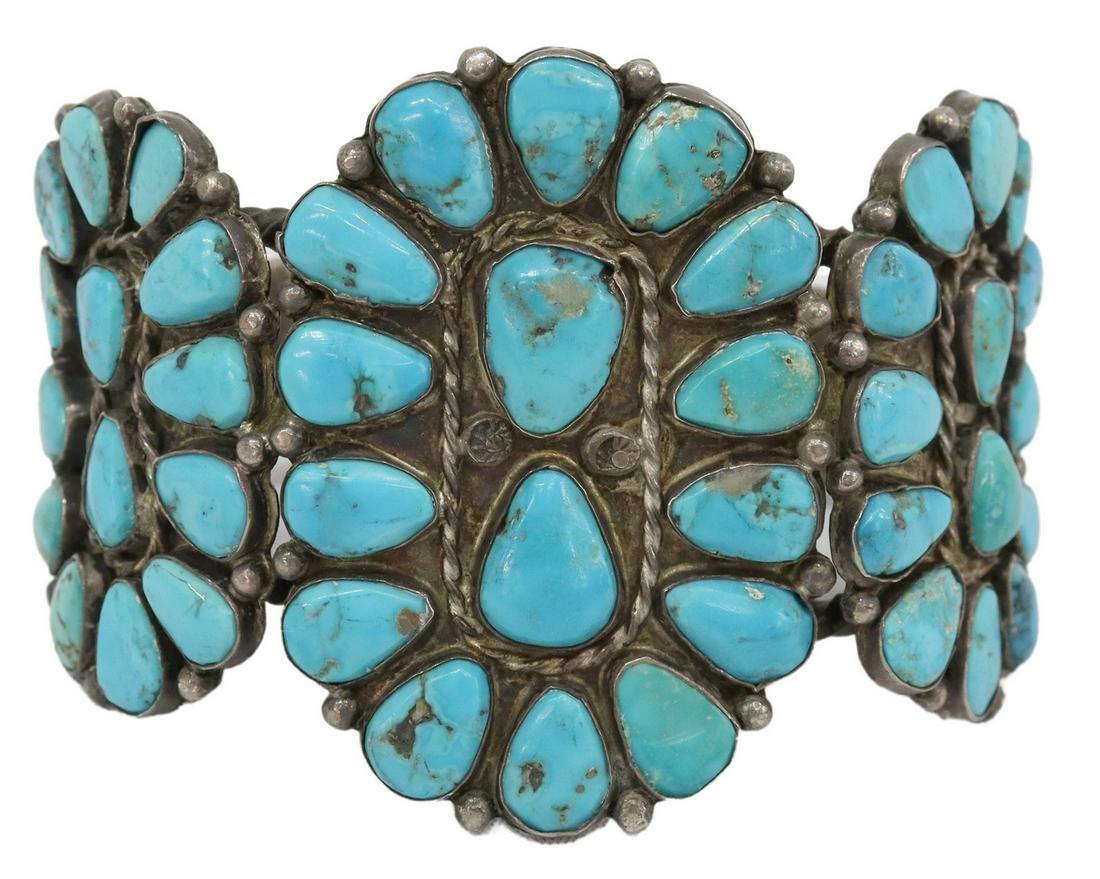 NATIVE AMERICAN SILVER & TURQUOISE CLUSTER CUFF: Native American silver (content unknown) cuff bracelet, three plaques with radiating clusters of turquoise, on a twisted split shank cuff, central plaque: approx 2.25"h, 1.5"w, interior: approx 6", ga