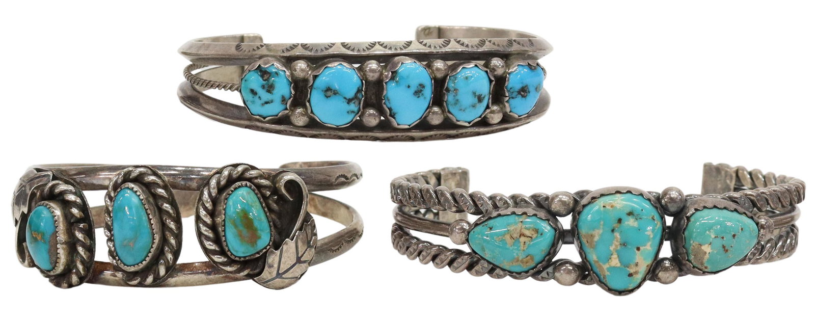 (3) NATIVE AMERICAN SILVER & TURQUOISE CUFF GROUP: (lot of 3) Native American silver and turquoise cuff bracelets, including: (1) having stamped frame, three prongs with central twisted wire, fitted with five bezel-set turquoise stones, picto hallmark