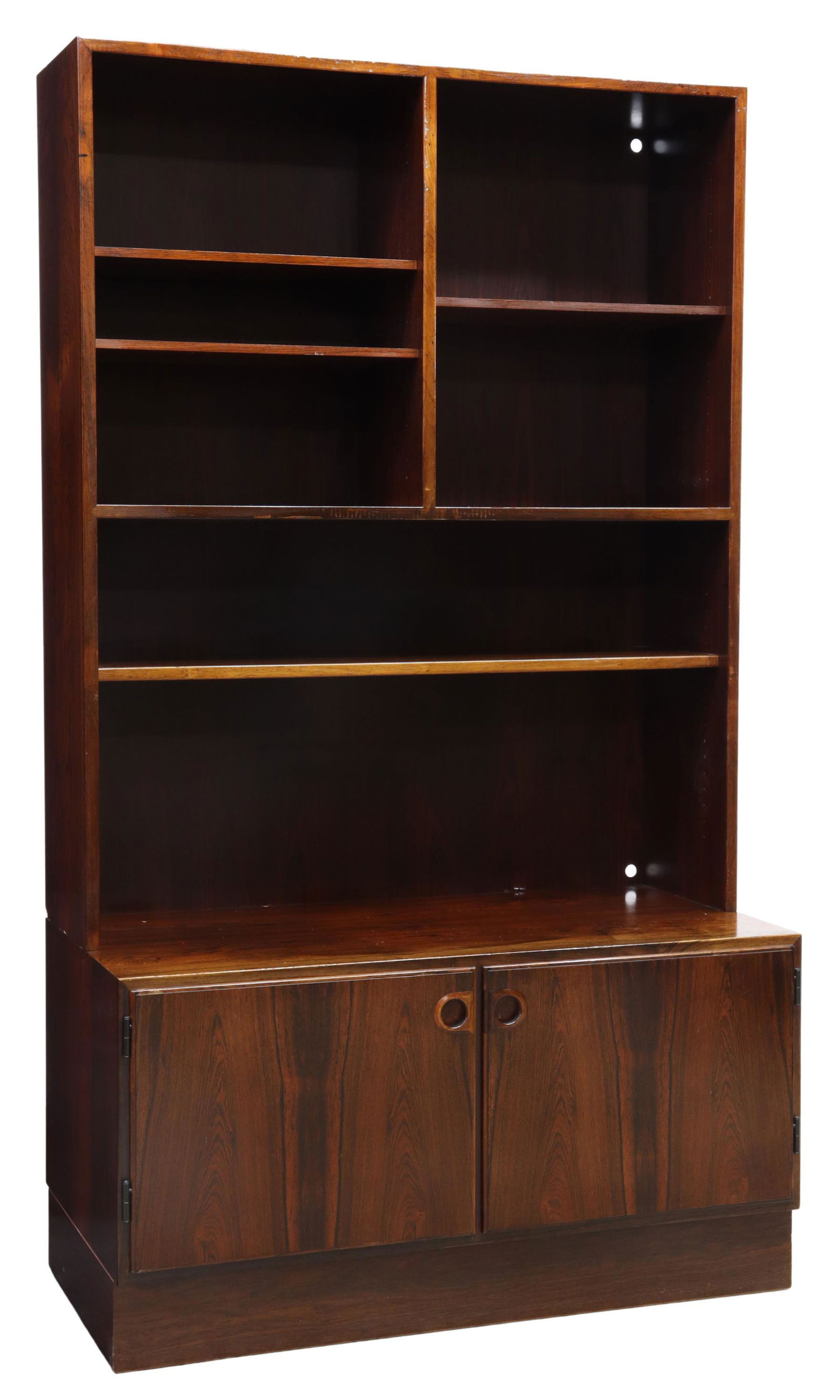 DANISH MID-CENTURY OMANN JUN ROSEWOOD BOOKCASE: Danish mid-century modern rosewood bookcase, manufactured by Omann Jun, c.1960s, upper case fitted with adjustable-height shelves, over rectangular lower cabinet fitted with double doors, opening to i