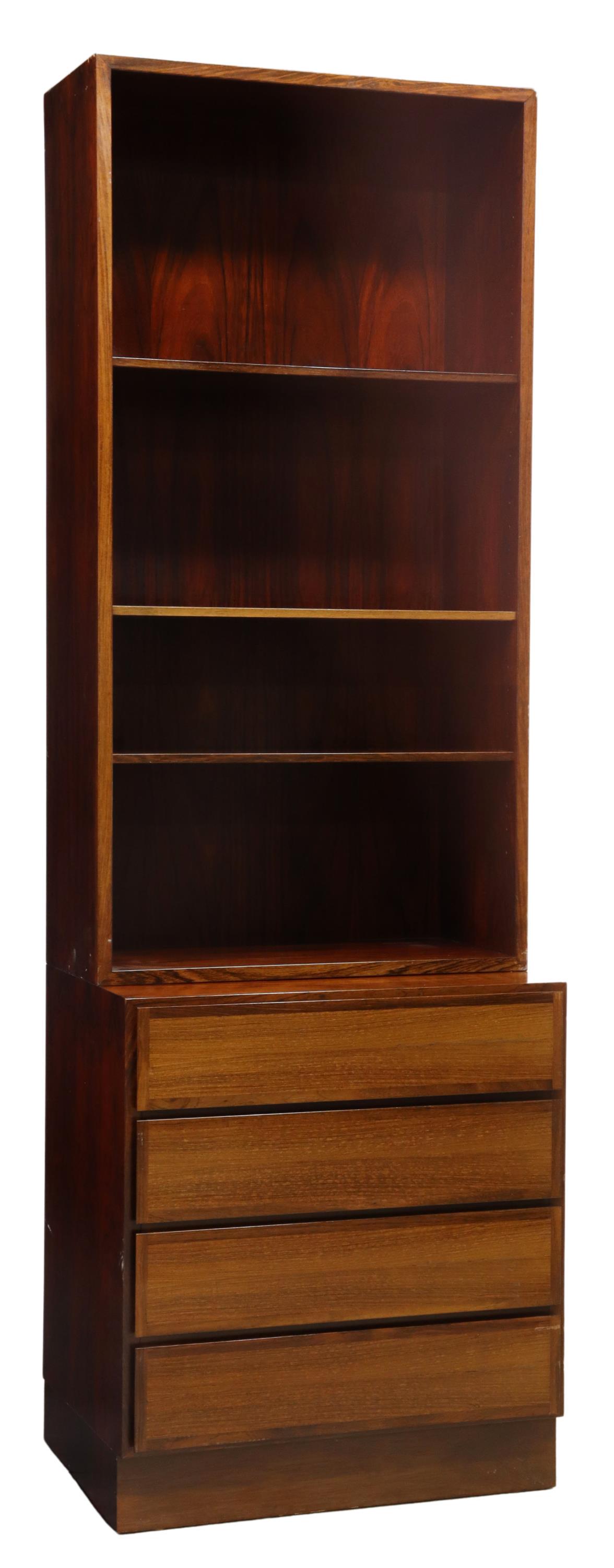 DANISH OMANN JUN MID-CENTURY ROSEWOOD BOOKCASE: Danish mid-century modern rosewood bookcase, manufactured by Omann Jun, c.1960s, upper section with adjustable-height shelves, lower case fitted with four drawers, on a plinth base, approx 74"h, 24"w,