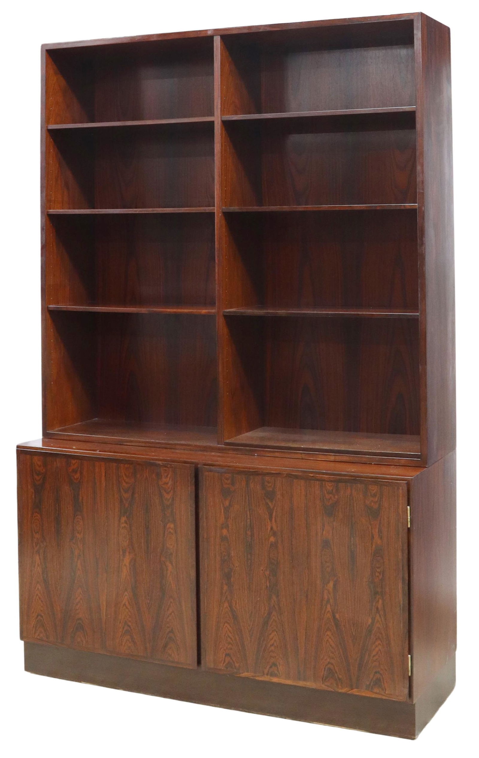 DANISH MID-CENTURY MODERN ROSEWOOD BOOKSHELF: Danish mid-century modern rosewood bookshelf, design No. 6, manufactured by Omann Jun, c.1960s, having six adjustable open shelves over two cabinet doors, opening to eight pull-out tray drawers and ca
