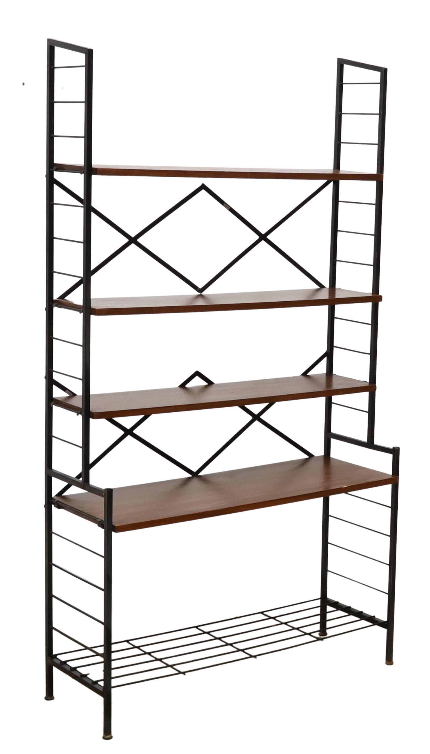 ITALIAN MID-CENTURY MODERN TEAK BOOKSHELF: Italian mid-century modern bookshelf, c.1960s, black enameled steel frame, four adjustable-height teak shelves, lower slatted shelf, approx 60.25"h, 32.75"w, 12.5"d Start Price: $150.00