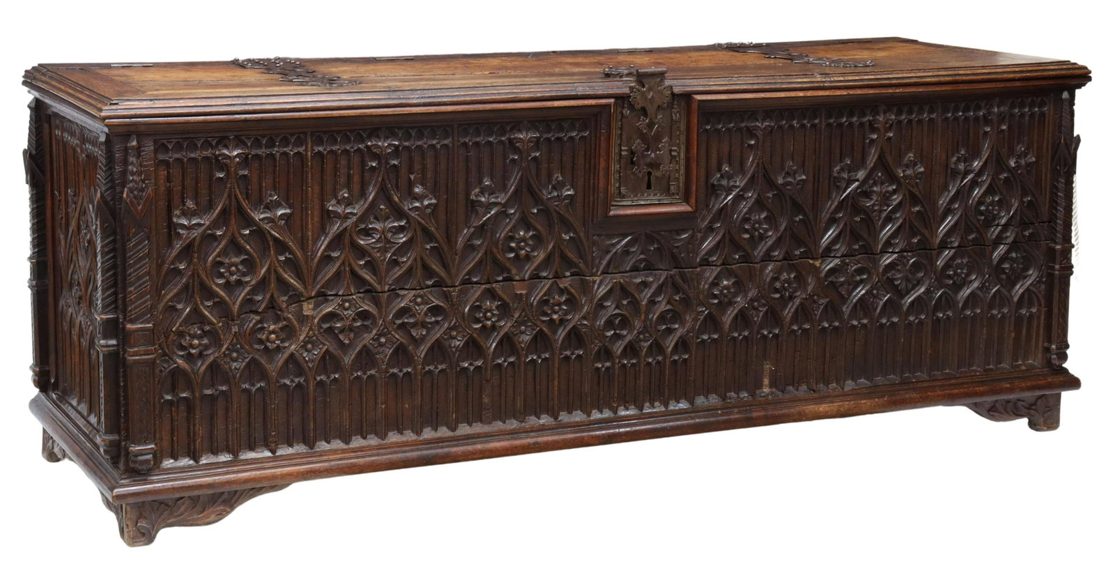 FRENCH GOTHIC REVIVAL TRACERY-CARVED OAK COFFER: French Gothic Revival oak coffer/ storage trunk, early 19th c., decorative iron strap hinges and lock, stabilized with later hinges, front and side panels carved with Gothic-inspired tracery, corners 