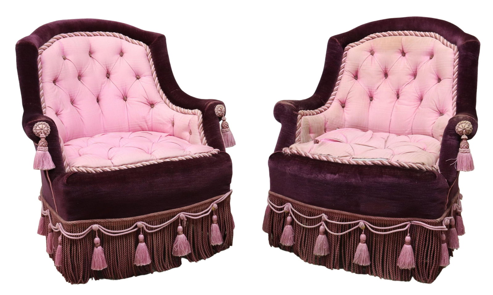 2) FRENCH NAPOLEON III STYLE UPHOLSTERED ARMCHAIRS: (pair) French Napoleon III style armchairs, early 20th c., in velvet upholstery, tufted back and seat, rope trim, apron accented with rope tassels and fringe, rising on turned legs, ending in casters,